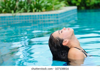Asian Woman In Swiming Pool