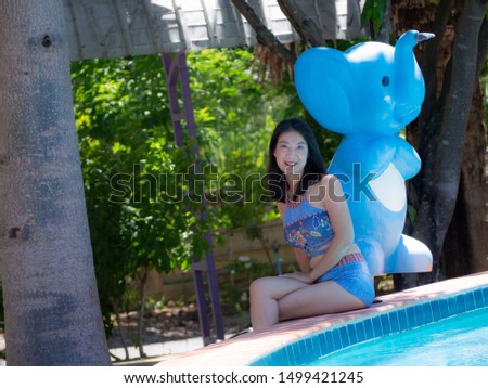 asian Woman swimsuit  Edge of the pool