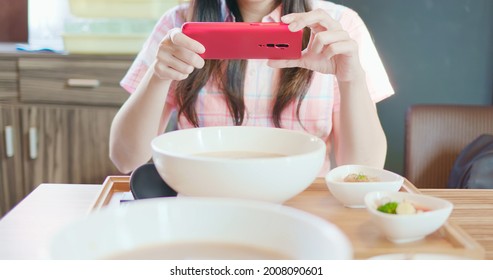 Asian Woman Take Picture Of Ramen Before She Eat Noodles