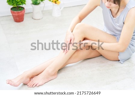 Asian woman taking her foot care at home