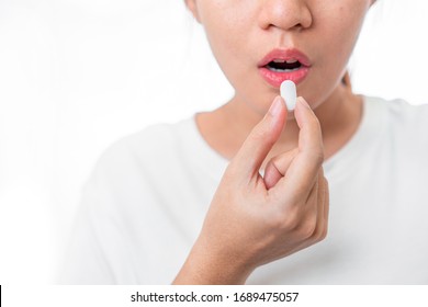 Asian Woman Taking Pill Need Treatment Isolate On White Background, Healthy Treatment Concept, Selective Focus.