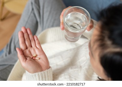 Asian Woman Taking Pill When Get Sick At Home