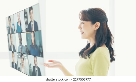 Asian Woman Taking Video Conference. Online Meeting. Webinar.