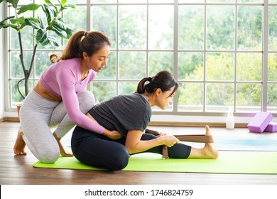 Asian Woman Teacher Teaching Yoga , Eka Pada Rajakapotasana Pose , Legged King Pigeon Exercise At Home. Personal Coach 
