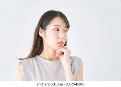 Asian Woman Thinking In White Background
