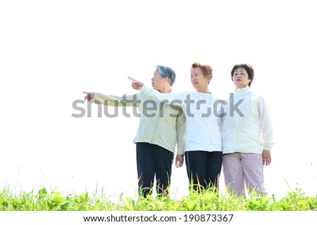 Asian woman threesome of elderly overlooking the sky