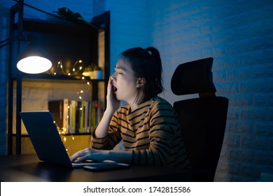 Asian woman tired and take a nap after overwork overtime at home. WFH. Work from home for avoid the Coronavirus COVID 19 concept. - Shutterstock ID 1742815586