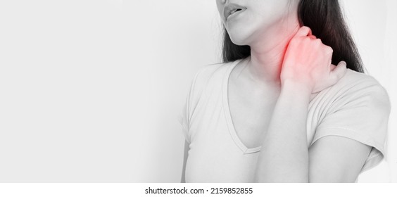 Asian woman touch her nape with feeling stress and pain caused by bad ergonomic and long hour working.