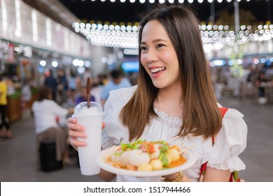 Asian Woman Tourists Eat Street Food Thailand In The Evening