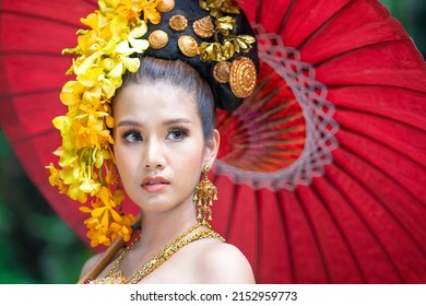Asian Woman With Traditional Thai Dress Holding Red Umbrella