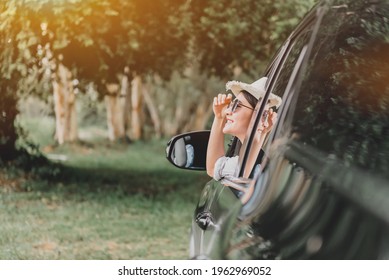 Asian Woman Travel By Car On Summer Holiday. Relax And Recreation At Natural Park.