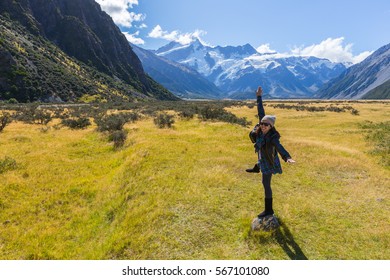 Asian Woman Travel Enjoy At Mt. Cook National Park In South Island New Zealand, Concept Of Woman Solo Travel And Relaxation Moment