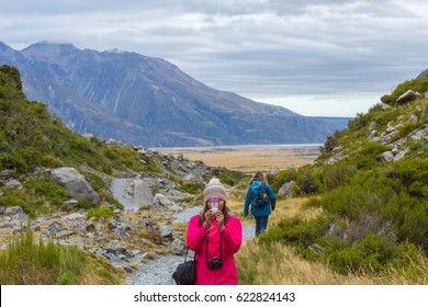 Asian woman travel enjoy at Mt. cook national park in New Zealand, Concept of woman solo travel and relaxation moment
