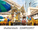 Asian woman travel in erawan shrine Bangkok city, Thailand