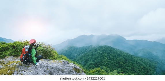  Asian woman Travel photograph Nature. travel relax in the holiday walk in the forest. on a rocky cliff. Thailand  - Powered by Shutterstock