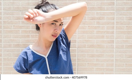 Asian Woman Under Hot Bright Sun.