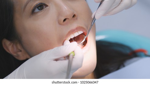 Asian Woman Undergo Check Up Of Tooth In Dental Clinic 