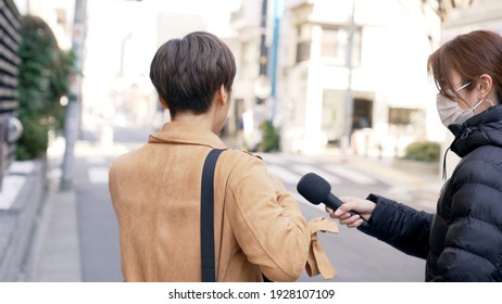 Asian Woman Undergoing A Street Interview.