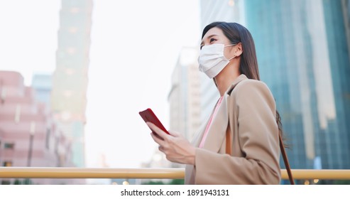 Asian Woman Use Smartphone Outdoor With Face Mask While Commuting