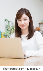 Asian Woman Using Laptop Computer.