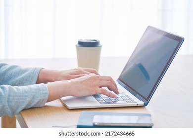 Asian Woman Using The Laptop At Home, No Face