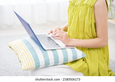 Asian Woman Using The Laptop At Home, No Face