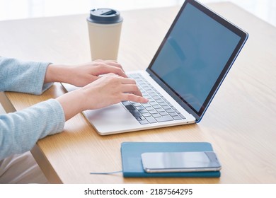 Asian Woman Using The Laptop At Home, No Face