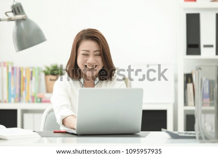 Asian woman using laptop, workplace at home . Concept of Asian woman lifestyle.