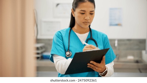 Asian woman, vet and writing with clipboard for results on animal medicine, study or diagnosis at clinic. Young female person or veterinarian taking notes for medical prescription or pet treatment - Powered by Shutterstock