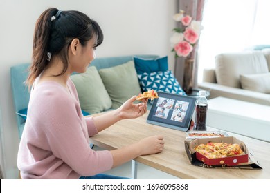 Asian Woman Virtual Happy Hour Meeting Party And Eating Food Online Together With Her Friend In Video Conference With Digital Tablet For A Online Meeting In Video Call For Social Distancing