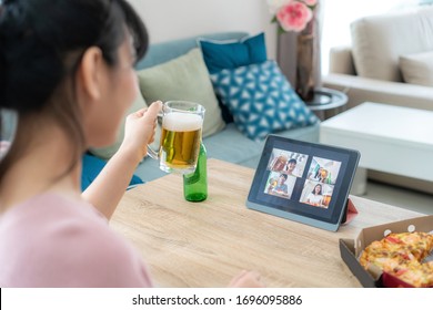 Asian Woman Virtual Happy Hour Meeting Party And Drinking Alcohol Beer Online Together With Her Friend In Video Conference With Digital Tablet For A Online Meeting In Video Call 