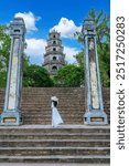 Asian woman visits Thien Mu Pagoda It is one of the ancient pagodas in Hue city. Near the Perfume River in the historic city of Hue, Vietnam