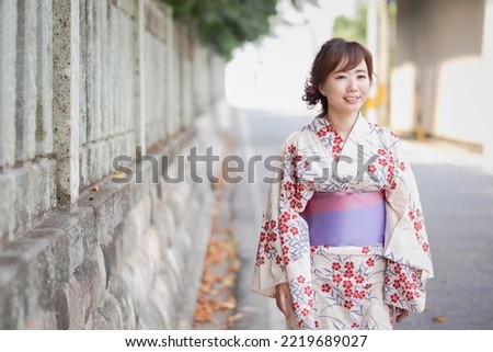 Asian woman walking in a shrine