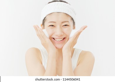 Asian Woman Washing A Face