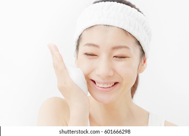 Asian Woman Washing A Face