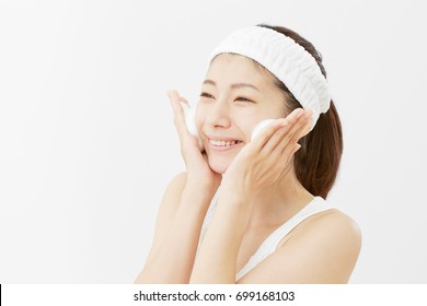 Asian Woman Washing A Face