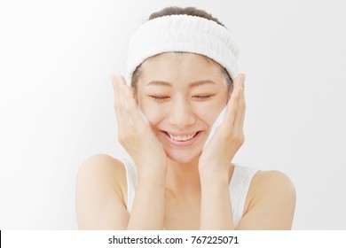 Asian Woman Washing A Face