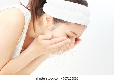 Asian Woman Washing A Face