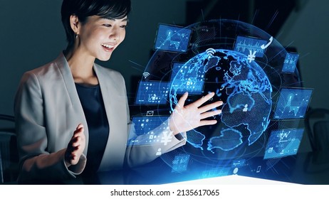 Asian woman watching hologram. Global network. - Powered by Shutterstock