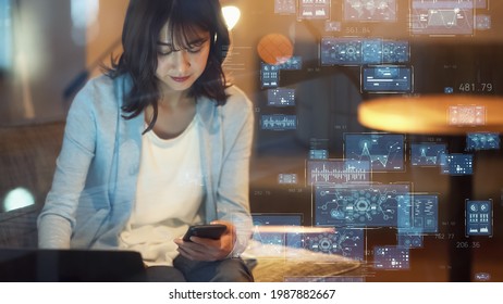 Asian woman watching hologram screens. Business and technology concept. Smart office. GUI (Graphical User Interface).