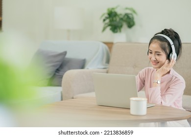 Asian Woman Watching Movies, Listening To Music, Video Calling At Home.