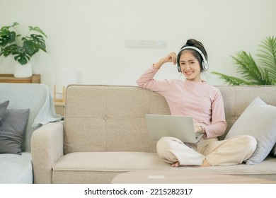 Asian Woman Watching Movies, Listening To Music, Video Calling At Home.