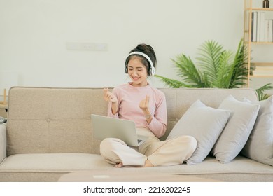 Asian Woman Watching Movies, Listening To Music, Video Calling At Home.