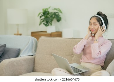 Asian Woman Watching Movies, Listening To Music, Video Calling At Home.