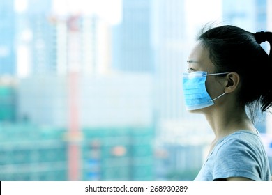 Asian Woman Wear Face Mask In Pollution City