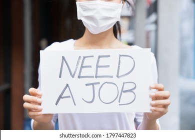 Asian Woman Wearing Face Mask, Having No Money Due To Job Cut, Employment Disruption After COVID-19 Pandemic Led Economic Recession