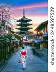 Asian woman wearing japanese traditional kimono at Yasaka Pagoda and Sannen Zaka Street in Kyoto, Japan.