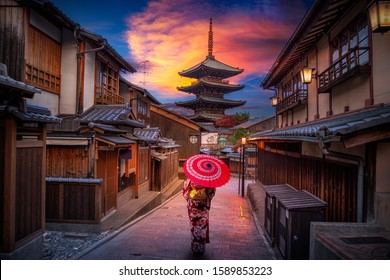 Asian woman wearing japanese traditional kimono, at Yasaka Pagoda and Sannen Zaka Street in Kyoto, Japan.