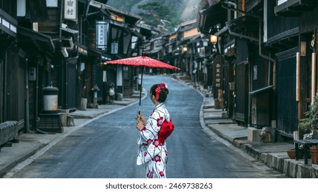 Asian woman wearing japanese traditional kimono at Narai juku in Nagano, Japan. Translation: 