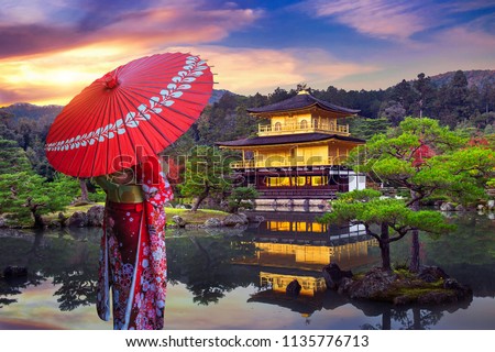 Asian woman wearing japanese traditional kimono at golden pavilion. Kinkakuji Temple in Kyoto, Japan.